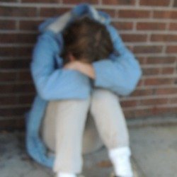 addict sitting head on knees,drug addiction suicide