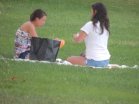 two girls sitting on grass-is suicide selfish